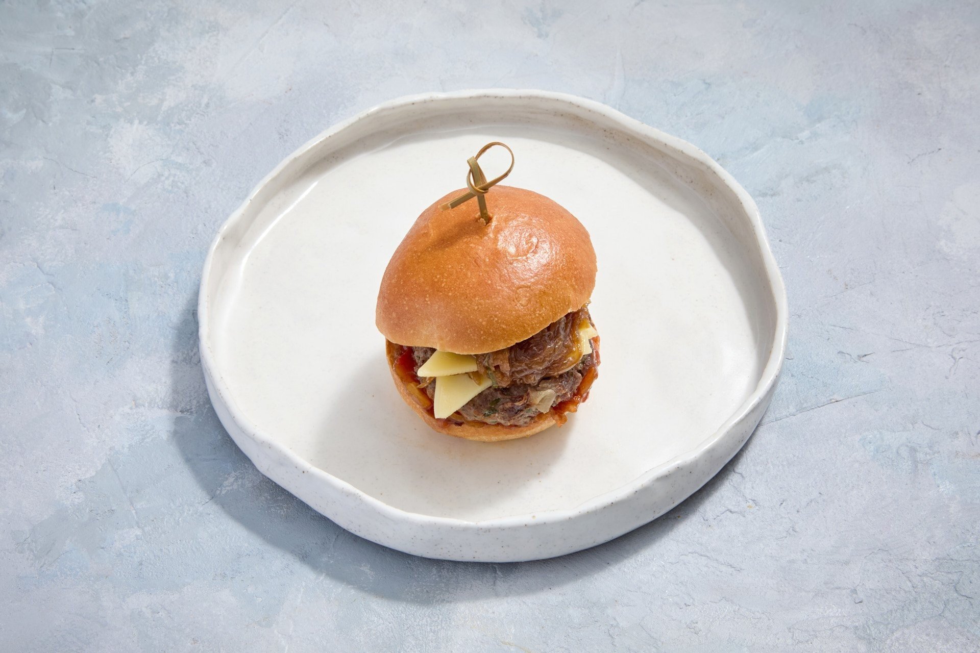 Cheeseburger, Onion Jam with Tomato Chutney on a Milk Bun